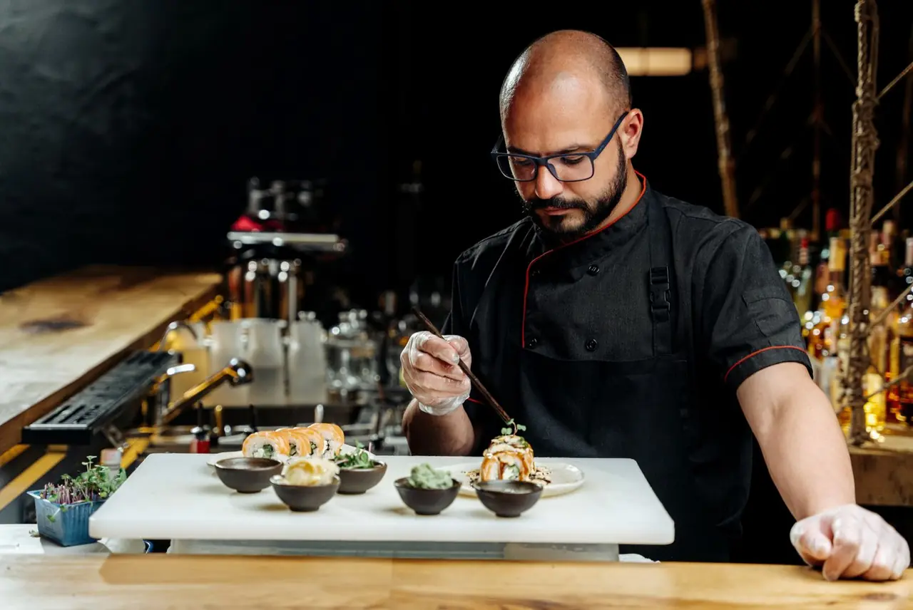 Kitchen chef measuring roll ingredients on cutting board